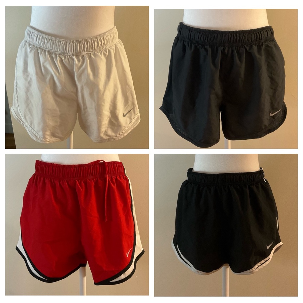 4 pair of women’s medium Nike Dri Fit Shorts